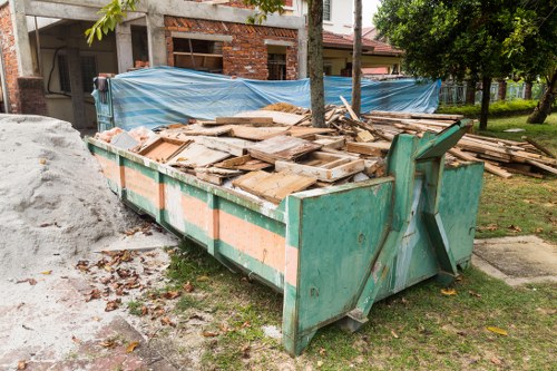 Exterior view of a skip delivery truck near a residential street