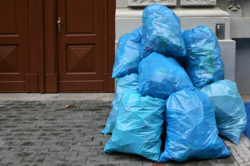 People using a skip for waste disposal in Shoreditch